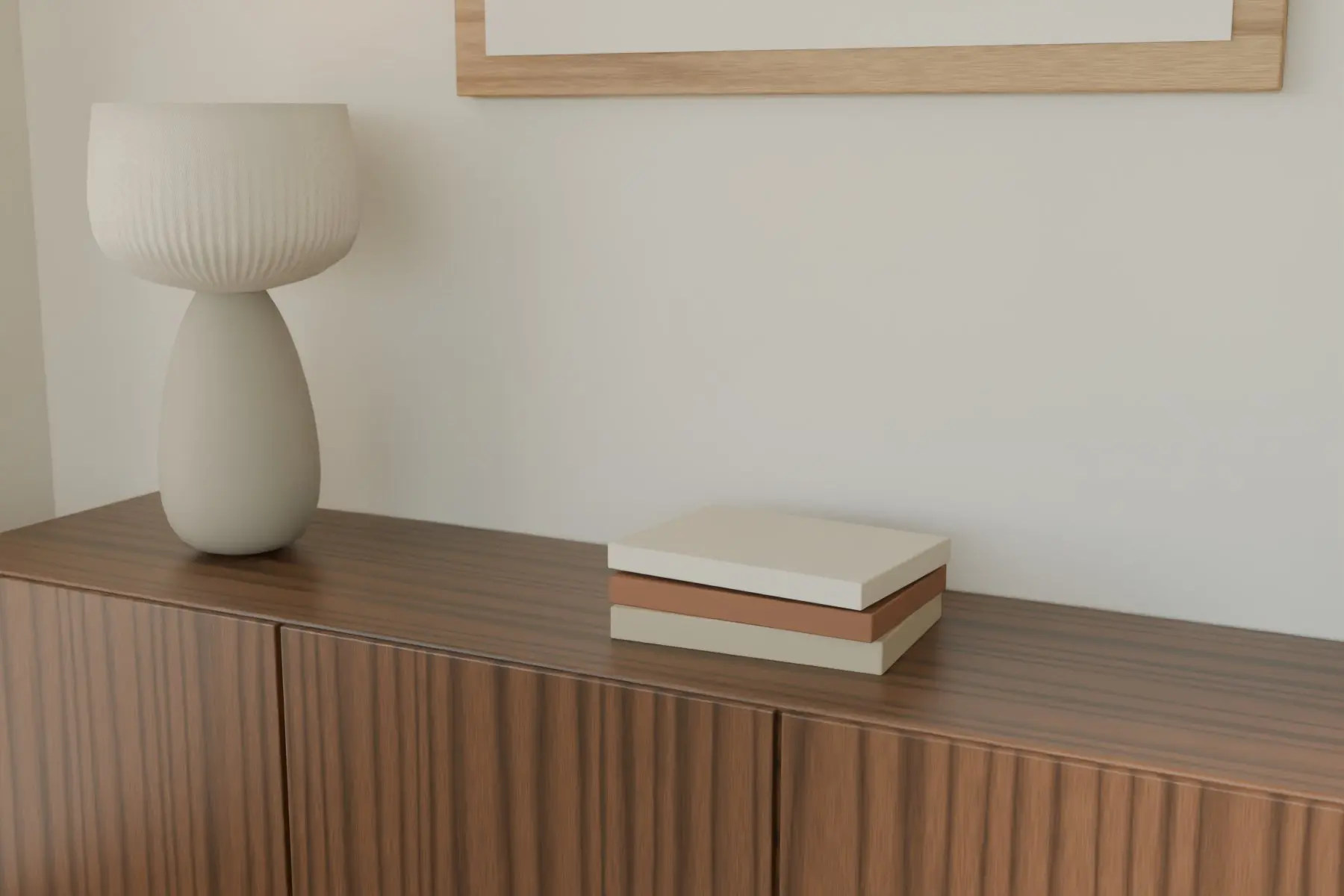 Concept render of a walnut sideboard with a ribbed ceramic lamp and books