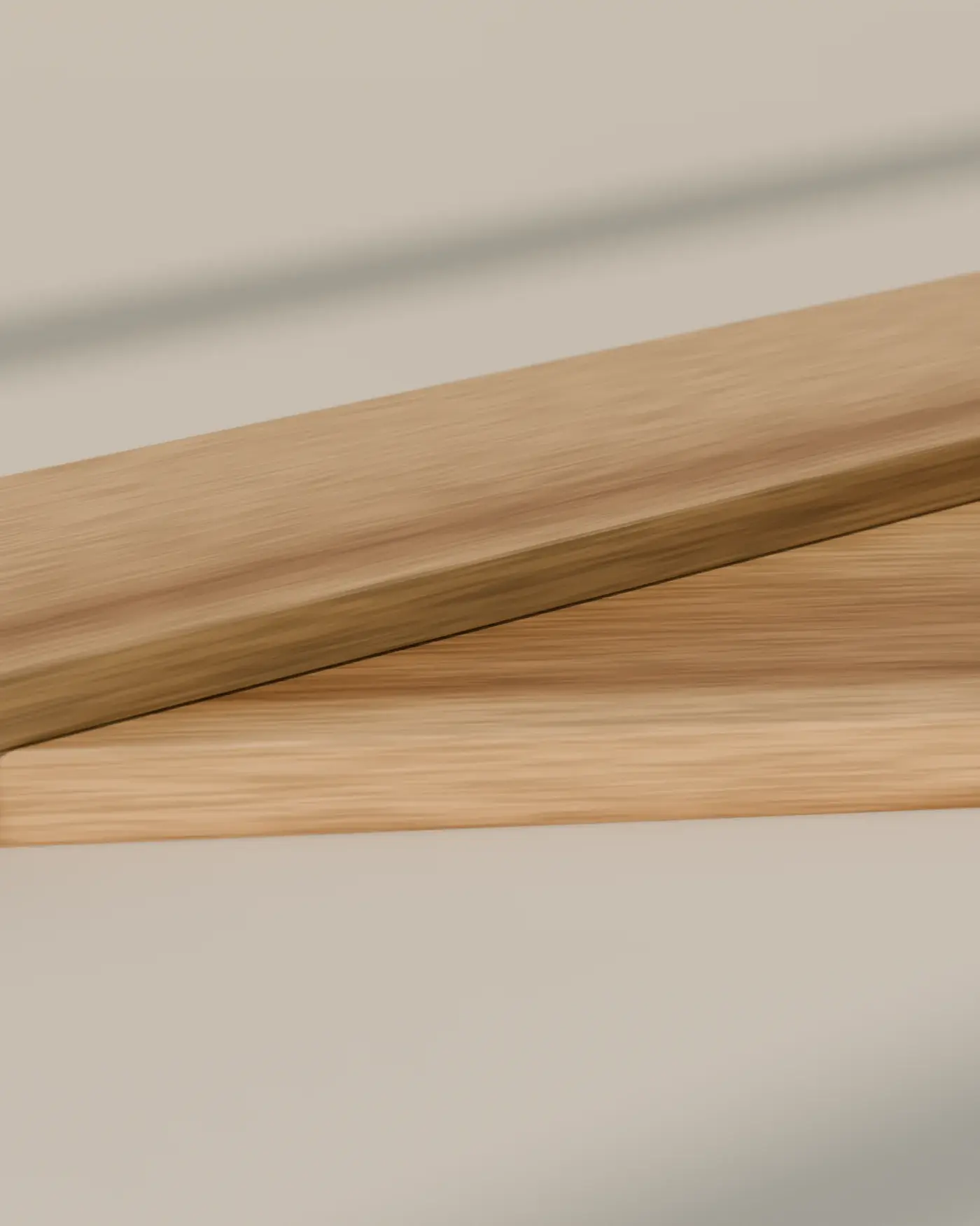 Two oiled oak boards in raking daylight, their grain running along the length