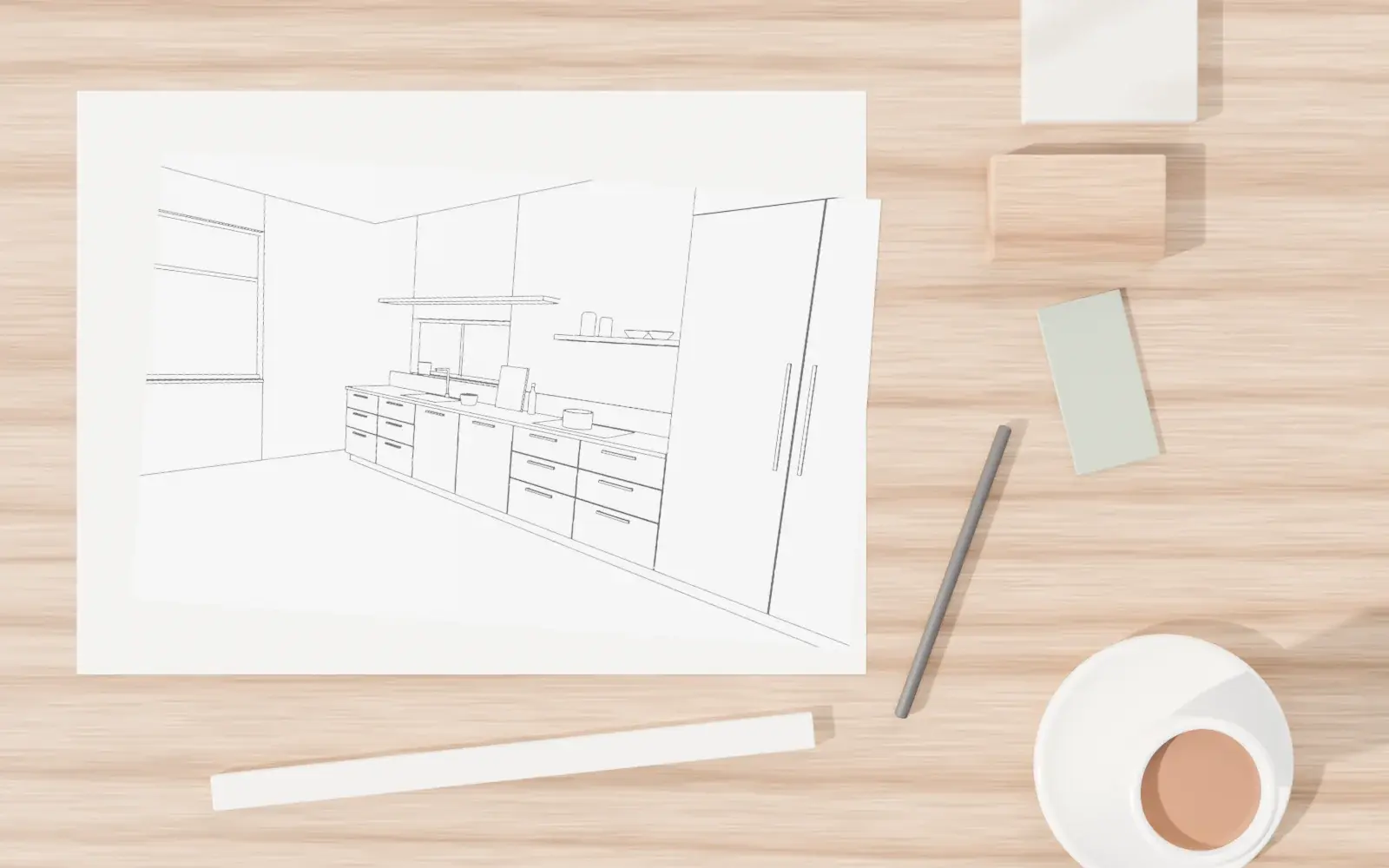 A kitchen drawing on an oak table with a scale rule, pencil, material samples and a cup of chai